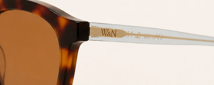 Wink & Nod Amalfi sunglasses in Havana with translucent blue temples, brown lenses — temple detail with gold W&N logo