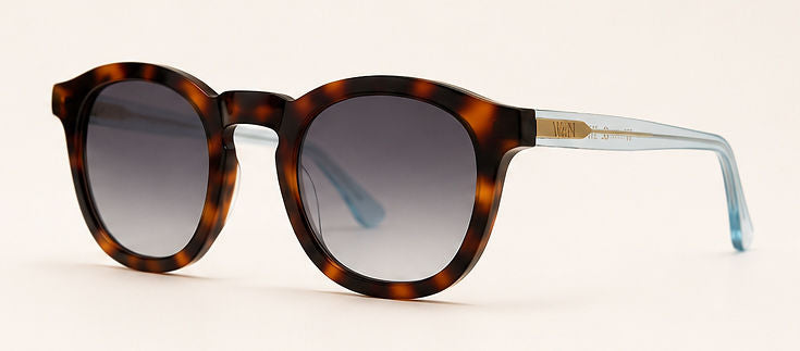 Wink & Nod Amalfi sunglasses in Havana with translucent blue temples, gray lenses — three-quarter view