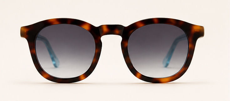 Wink & Nod Amalfi Sun Readers in Havana with translucent blue temples, gray lenses — front view