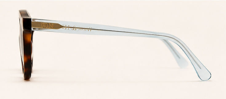 Wink & Nod Amalfi Sun Readers in Havana with translucent blue temples, gray lenses — left side profile