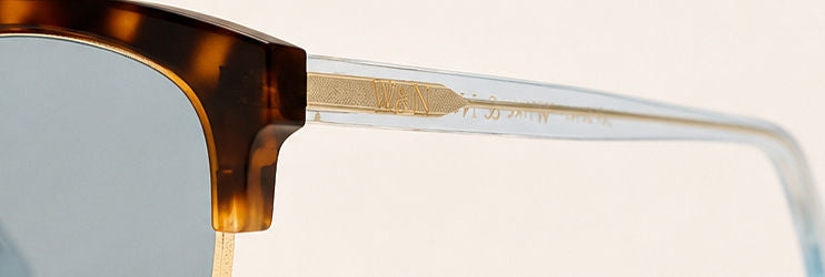 Wink & Nod Sorrento sunglasses in Havana with translucent sea glass temples, gray lenses — temple detail with gold W&N logo